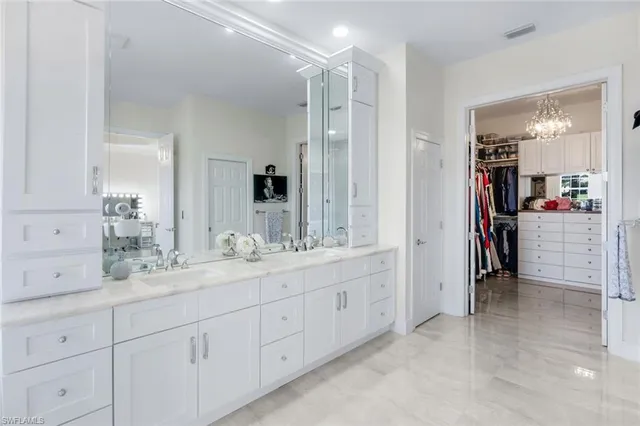 a bathroom with a double vanity sink and a bathtub