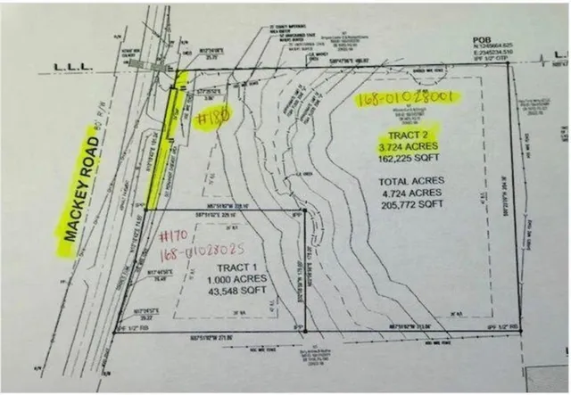 a view of a door with an umbrella and a white bed