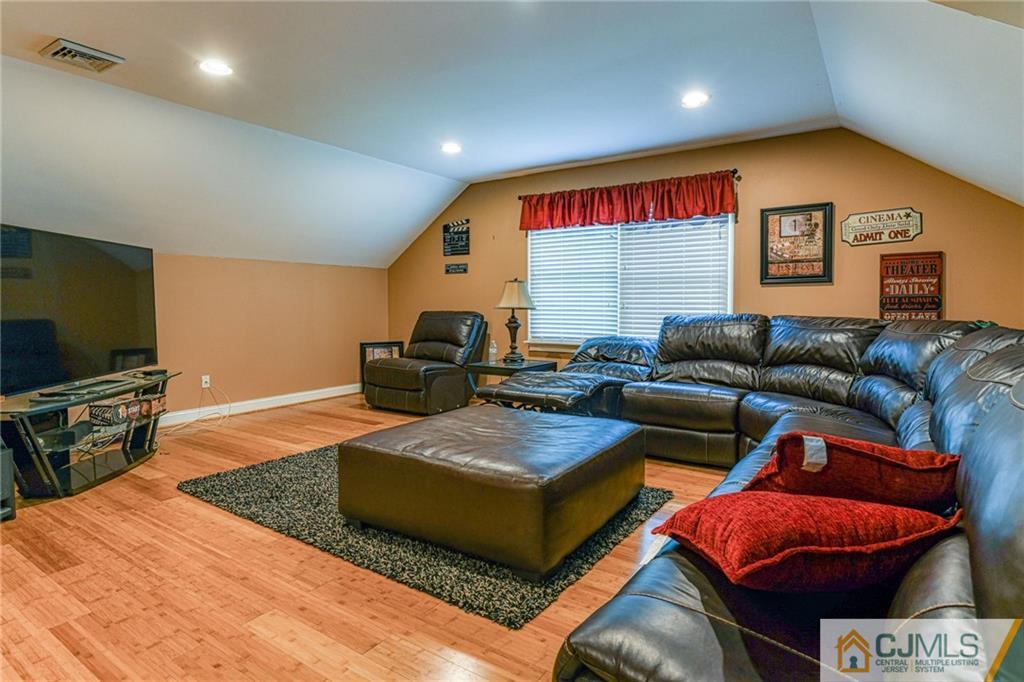 85 Davidson's Mill Road North Brunswick, NJ 08902 - Photo 37 of 39 a living room with furniture and a flat screen tv