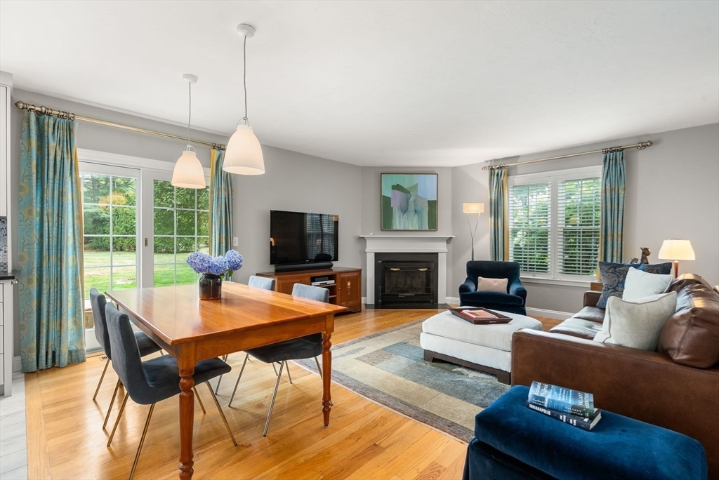 5 Upham Way, Unit 5 Weston, MA 02493 - Photo 11 of 29 a living room with furniture a fireplace and a flat screen tv