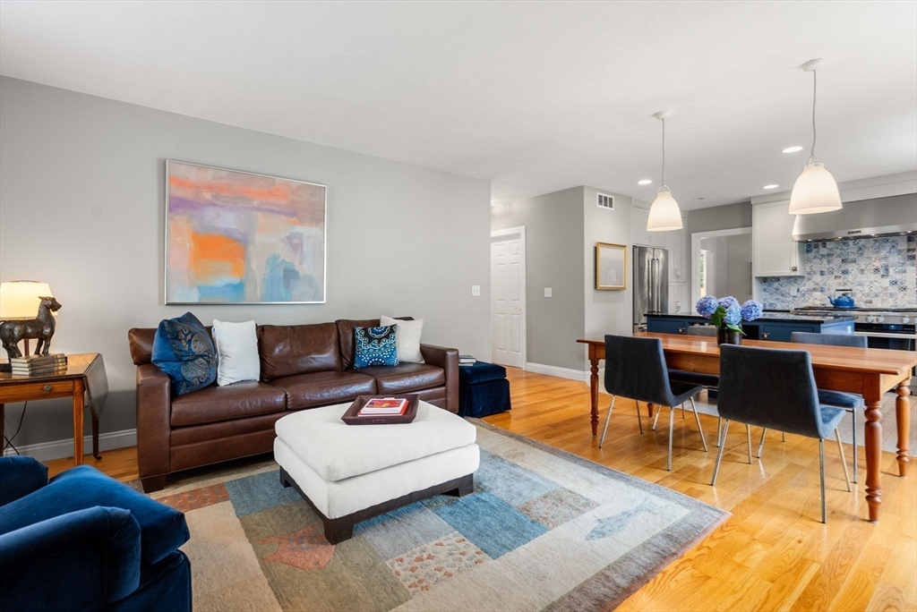 5 Upham Way, Unit 5 Weston, MA 02493 - Photo 12 of 29 a living room with furniture a rug and kitchen view