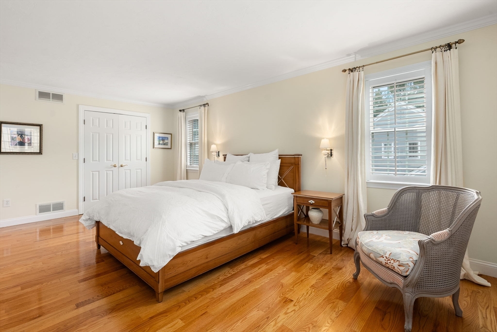 5 Upham Way, Unit 5 Weston, MA 02493 - Photo 18 of 29 a bed room with a bed and a chair