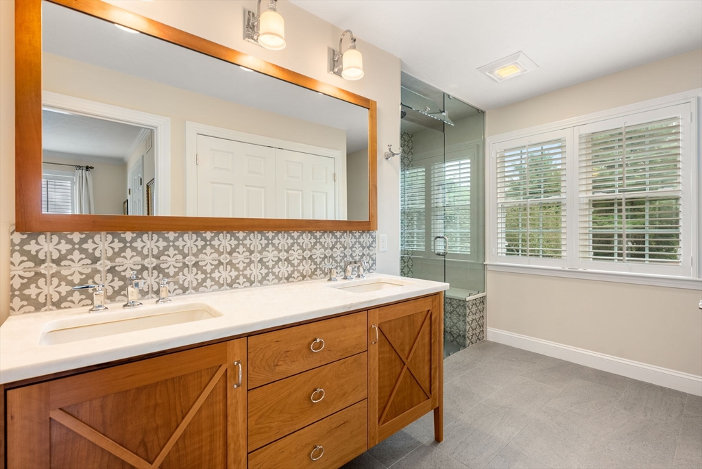 5 Upham Way, Unit 5 Weston, MA 02493 - Photo 19 of 29 a bathroom with a sink and a large mirror