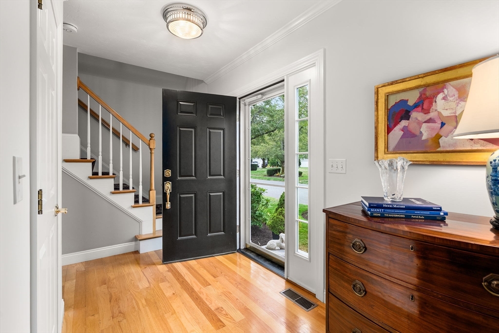 5 Upham Way, Unit 5 Weston, MA 02493 - Photo 2 of 29 a view of an entryway with wooden floor