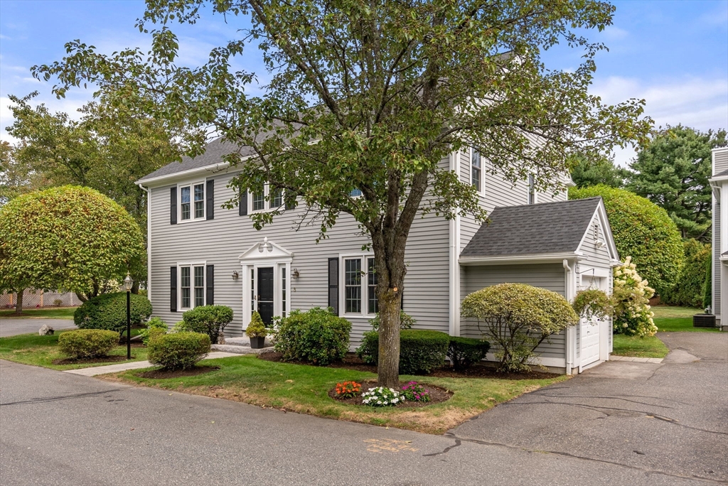 5 Upham Way, Unit 5 Weston, MA 02493 - Photo 29 of 29 a front view of a house with garden