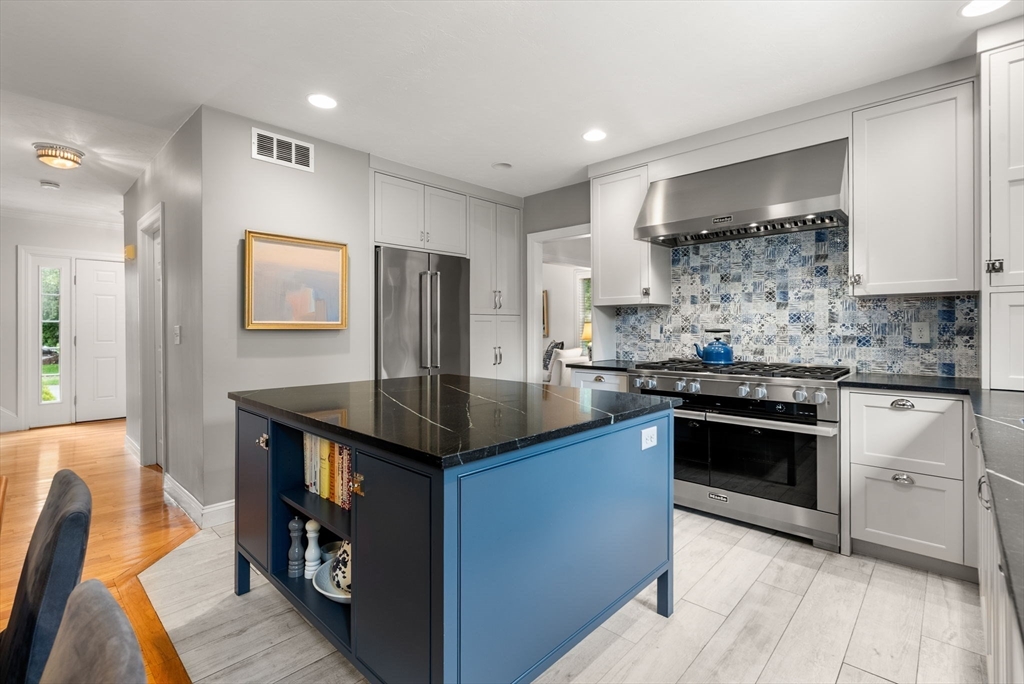 5 Upham Way, Unit 5 Weston, MA 02493 - Photo 3 of 29 a kitchen with stainless steel appliances granite countertop a stove a sink dishwasher and a refrigerator