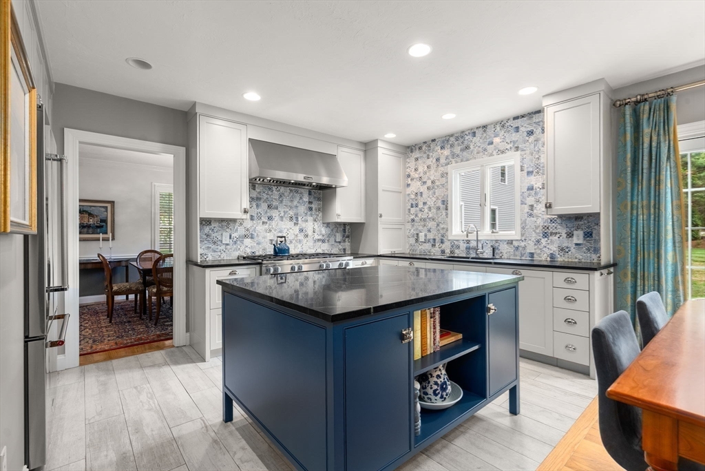 5 Upham Way, Unit 5 Weston, MA 02493 - Photo 4 of 29 a kitchen with granite countertop a sink stove and cabinets