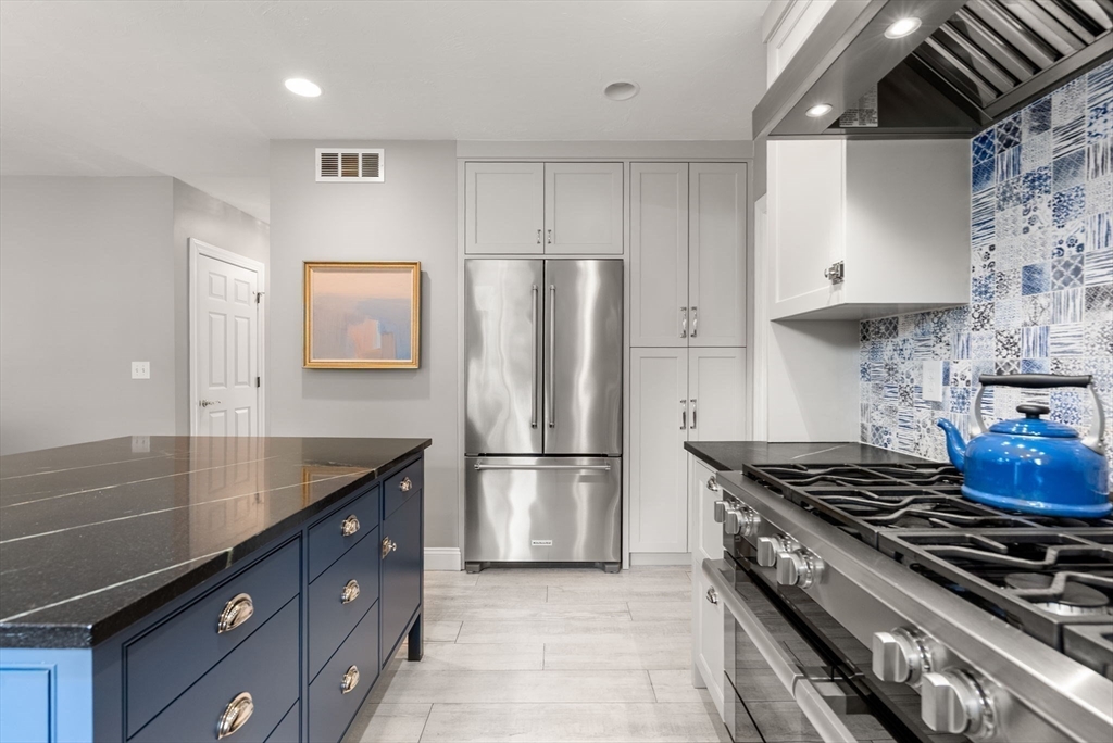 5 Upham Way, Unit 5 Weston, MA 02493 - Photo 7 of 29 a kitchen with refrigerator and stove