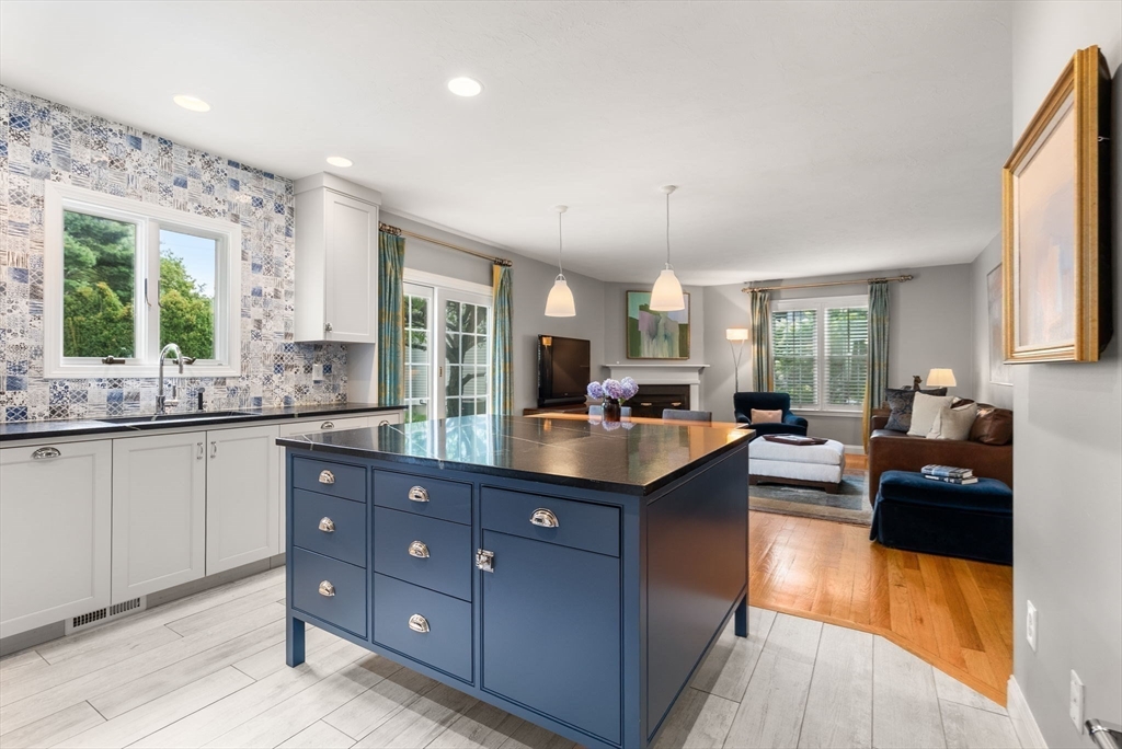 5 Upham Way, Unit 5 Weston, MA 02493 - Photo 9 of 29 a large kitchen with kitchen island granite countertop a large window and stainless steel appliances