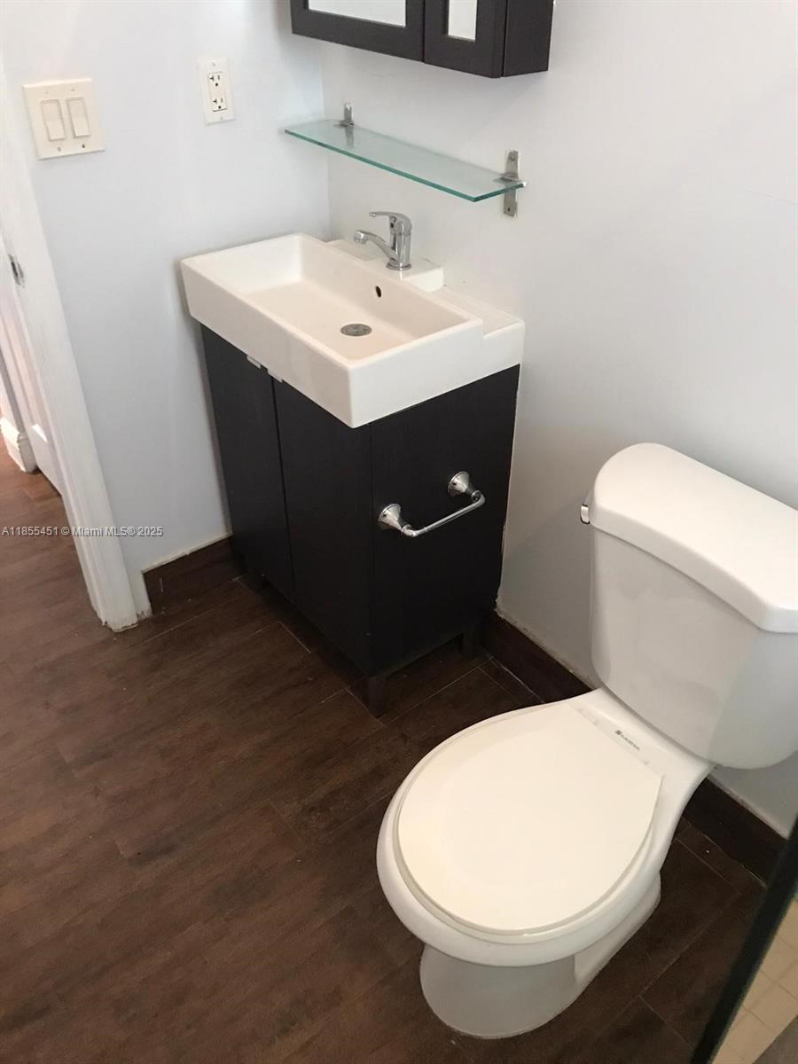131 Northwest 15th Street, Unit U Miami, FL 33136 - Photo 6 of 6 a bathroom with a toilet and a sink