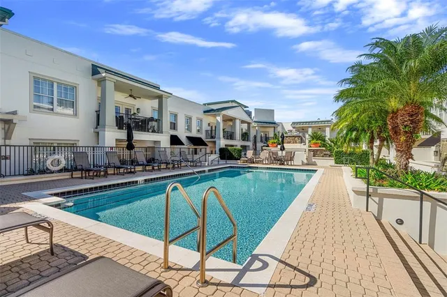 a view of swimming pool with outdoor seating