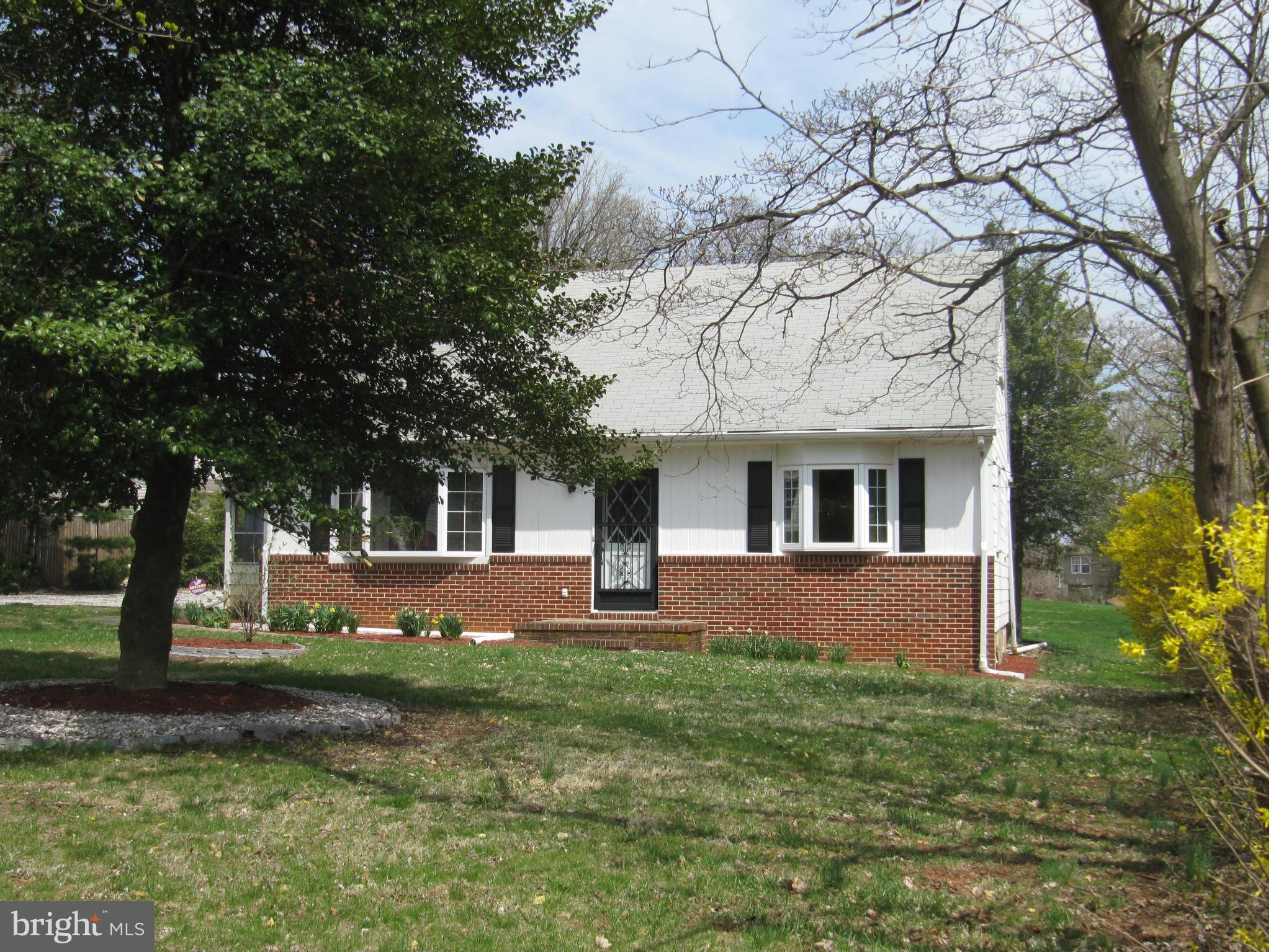 7518 Windsor Mill Road Baltimore, MD 21244 - Photo 1 of 17 front view of a house with a yard