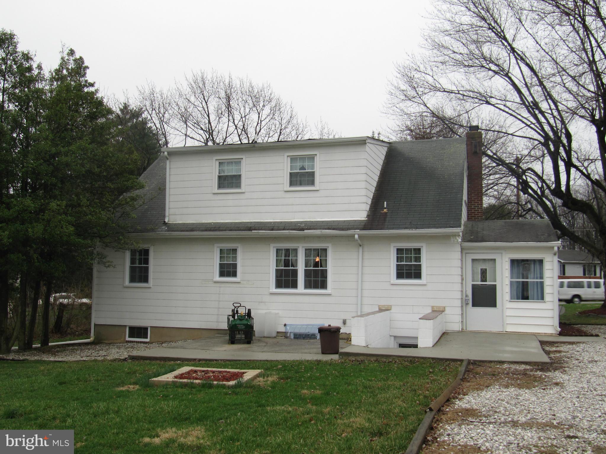 7518 Windsor Mill Road Baltimore, MD 21244 - Photo 14 of 17 a front view of house with yard and green space
