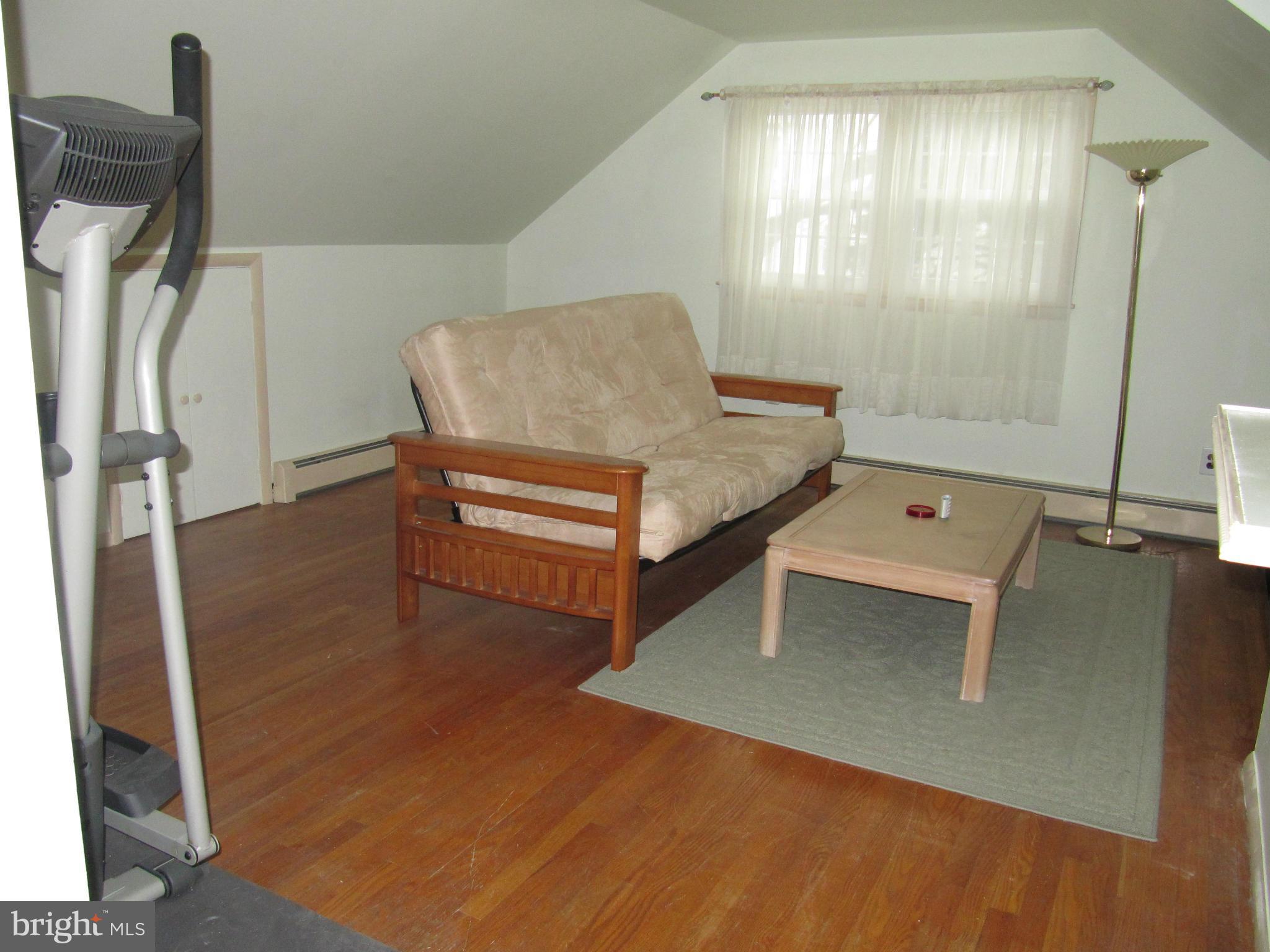7518 Windsor Mill Road Baltimore, MD 21244 - Photo 9 of 17 a living room with furniture and a window