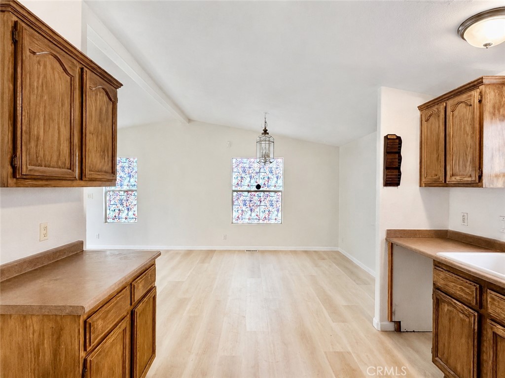 3067 Carl Street Riverside, CA 92507 - Photo 10 of 23 Open-concept kitchen flowing into an elegant, sophisticated dining room.