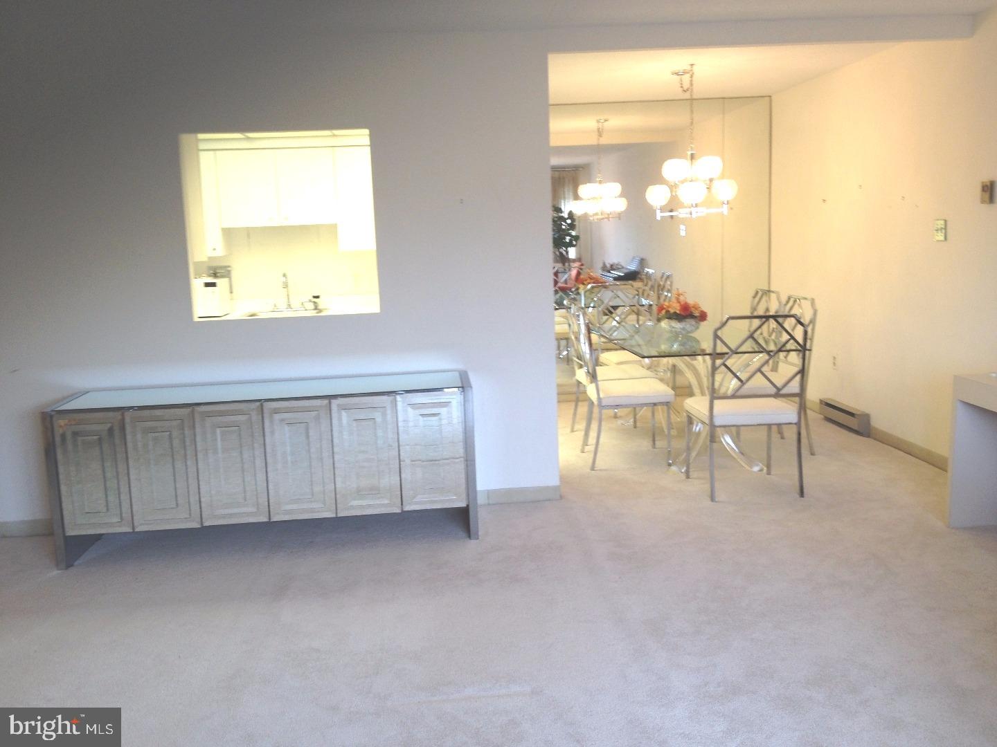 860 Lower Ferry Road, Unit 4F Ewing, NJ 08628 - Photo 12 of 18 a view of a room with a table and chairs
