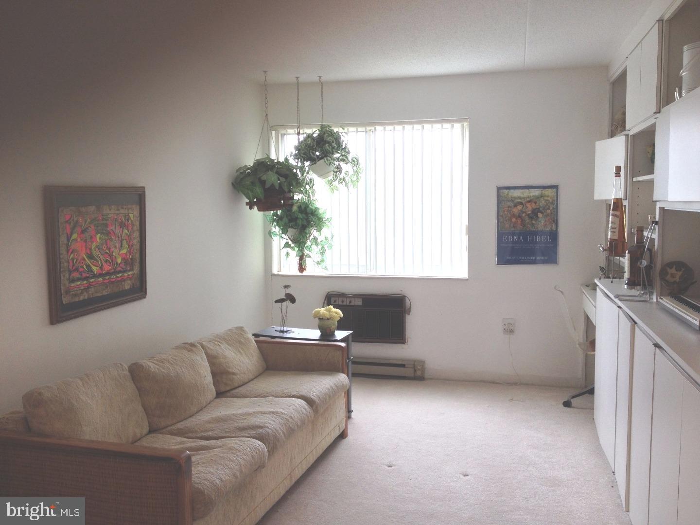 860 Lower Ferry Road, Unit 4F Ewing, NJ 08628 - Photo 5 of 18 a living room with furniture and a window