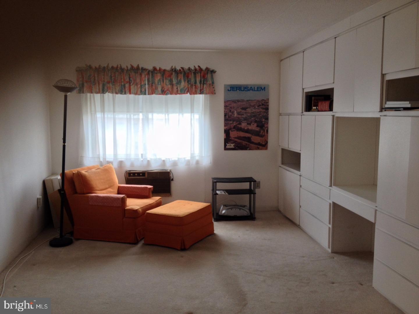 860 Lower Ferry Road, Unit 4F Ewing, NJ 08628 - Photo 6 of 18 a bedroom with furniture and a window