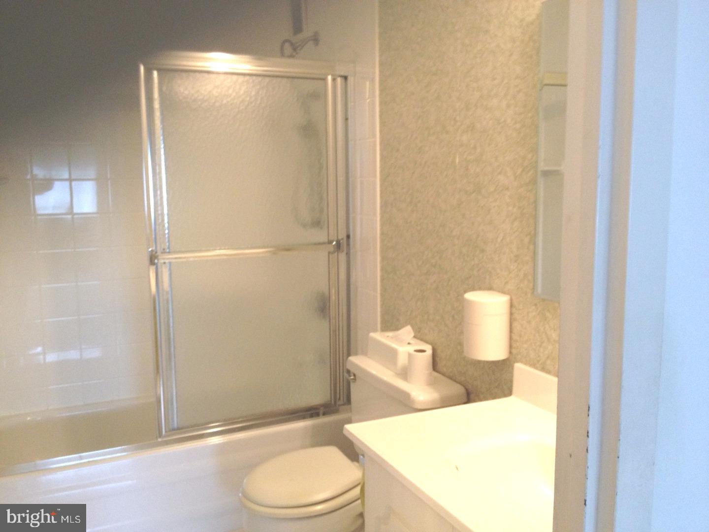 860 Lower Ferry Road, Unit 4F Ewing, NJ 08628 - Photo 7 of 18 a bathroom with a toilet a sink and shower