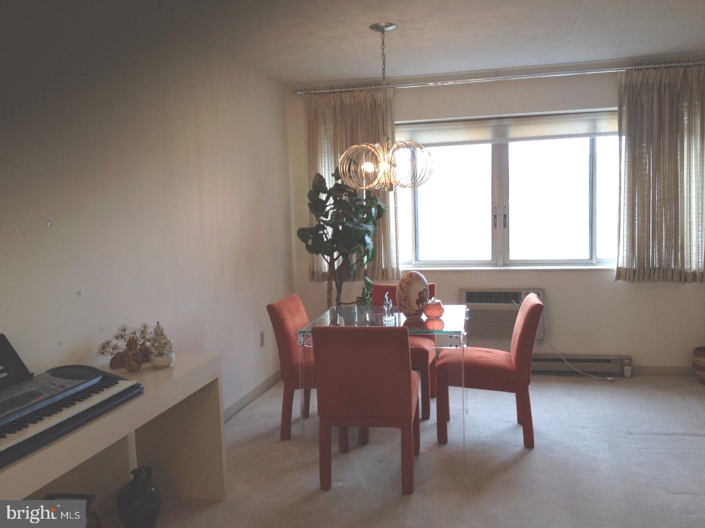 860 Lower Ferry Road, Unit 4F Ewing, NJ 08628 - Photo 10 of 18 a dining room with furniture and window
