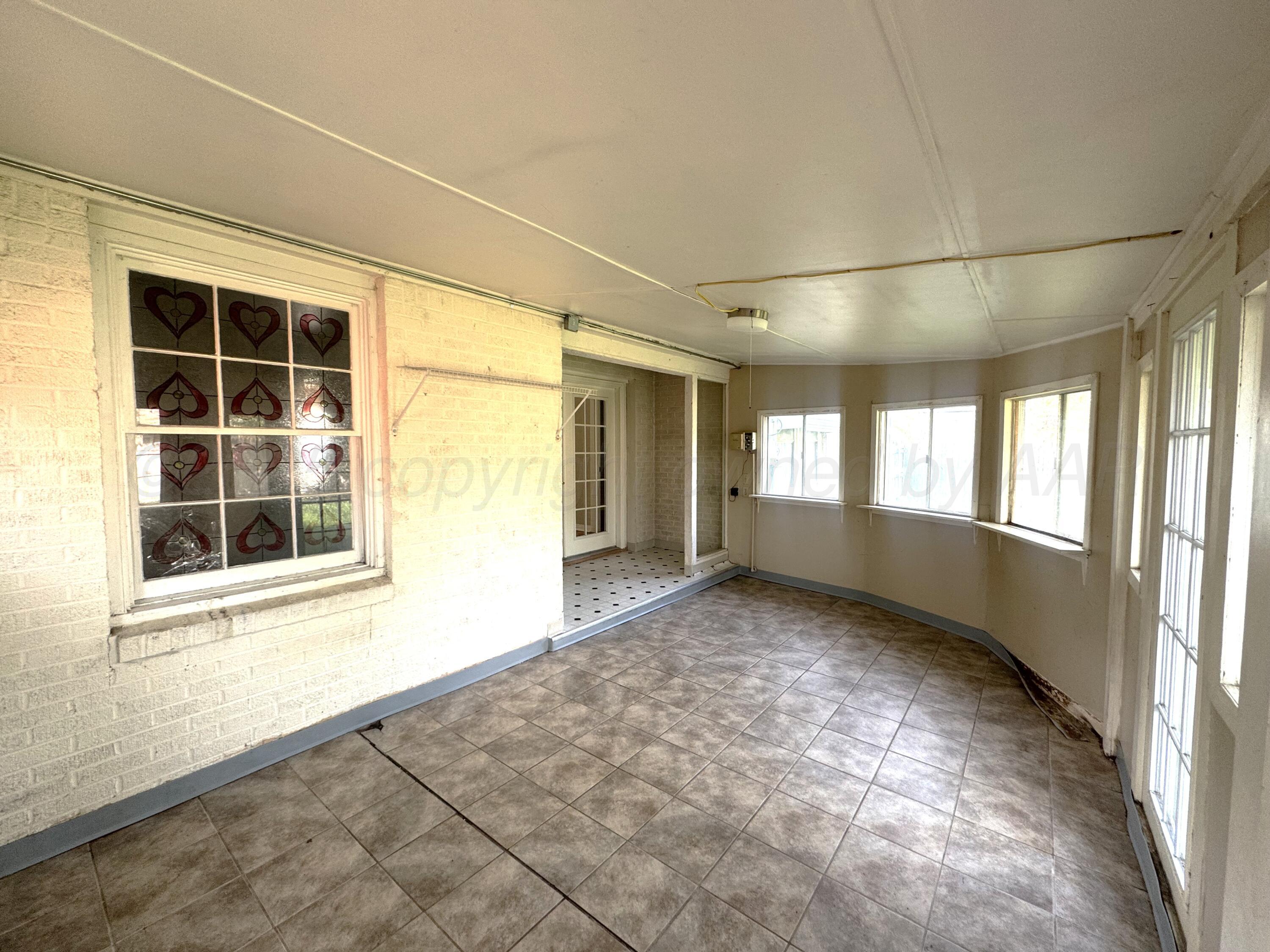 1222 South Bryan Street Amarillo, TX 79102 - Photo 10 of 18 a view of an empty room with a window