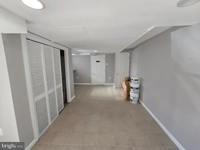 a view of a livingroom with a refrigerator