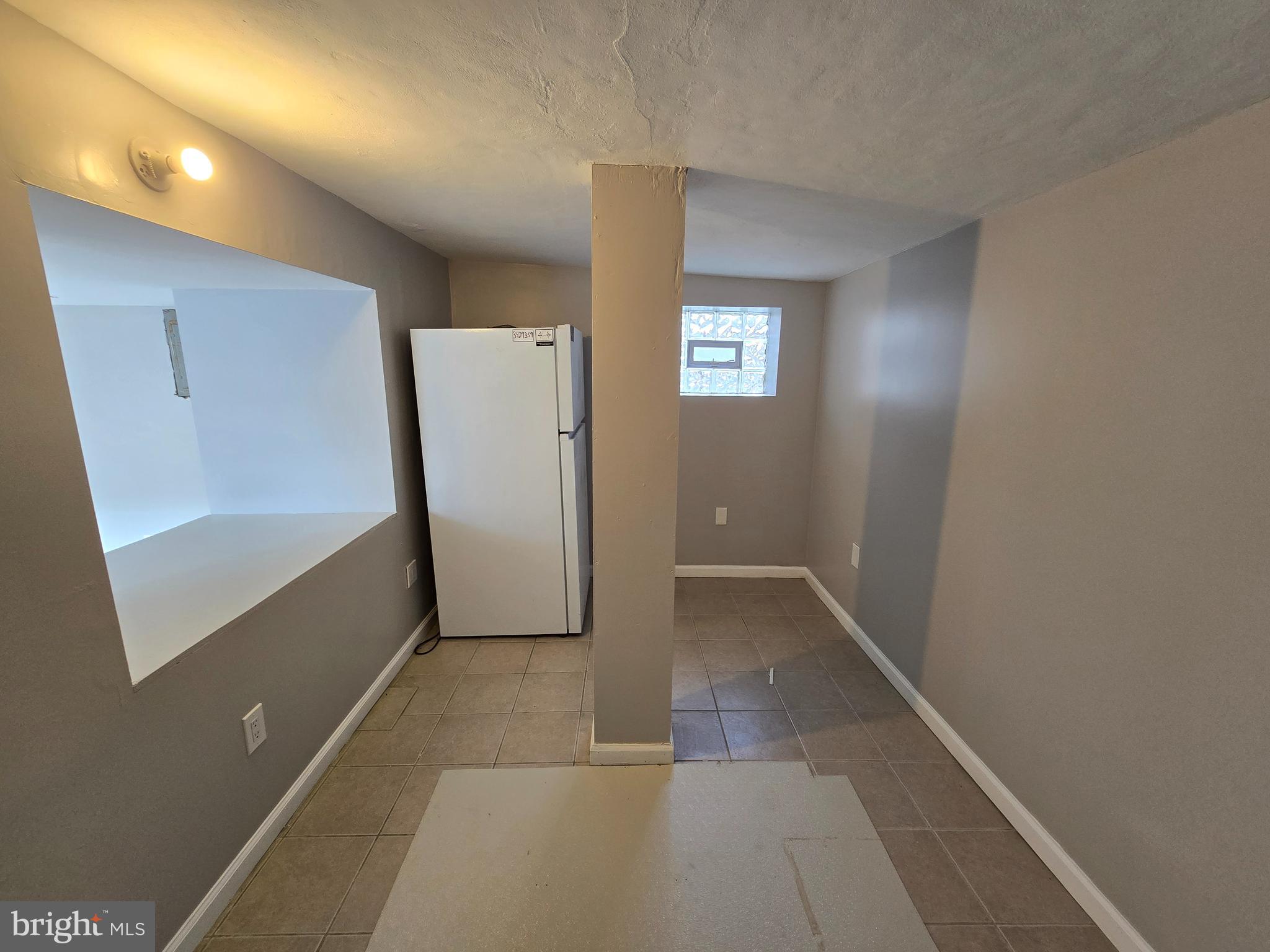 5901 Colgate Street Philadelphia, PA 19120 - Photo 7 of 10 a view of room with window and hallway