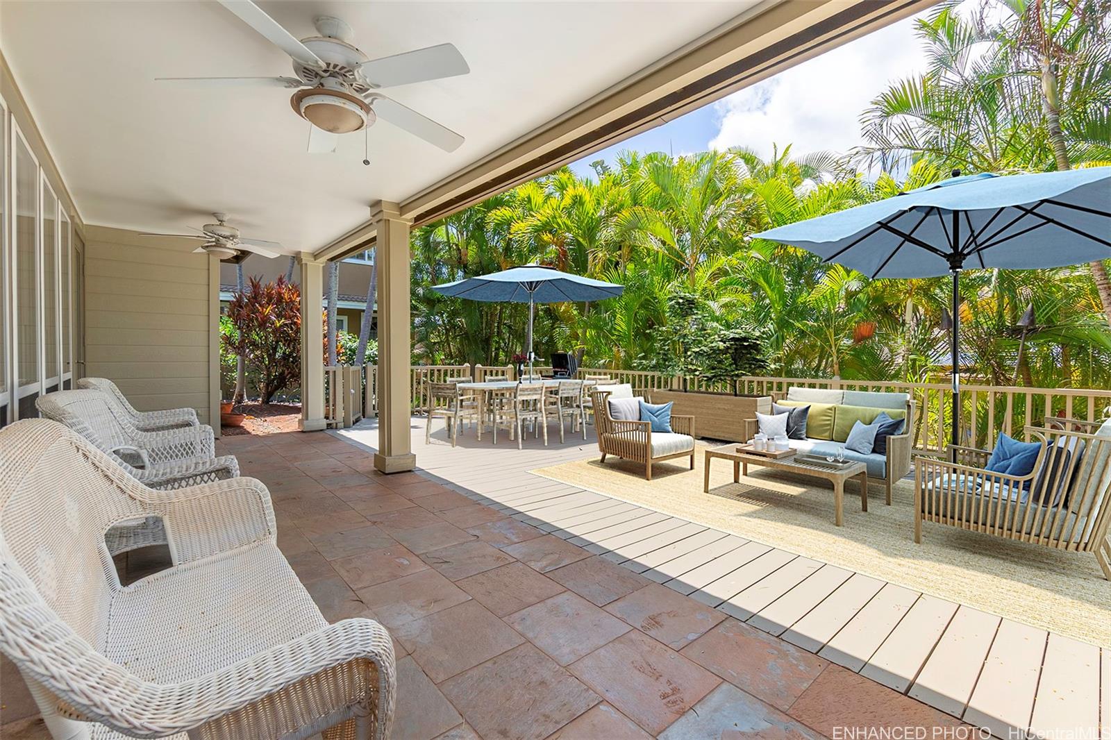92-247 Opuakii Place Kapolei, HI 96707 - Photo 14 of 25 a outdoor living space with furniture and umbrella