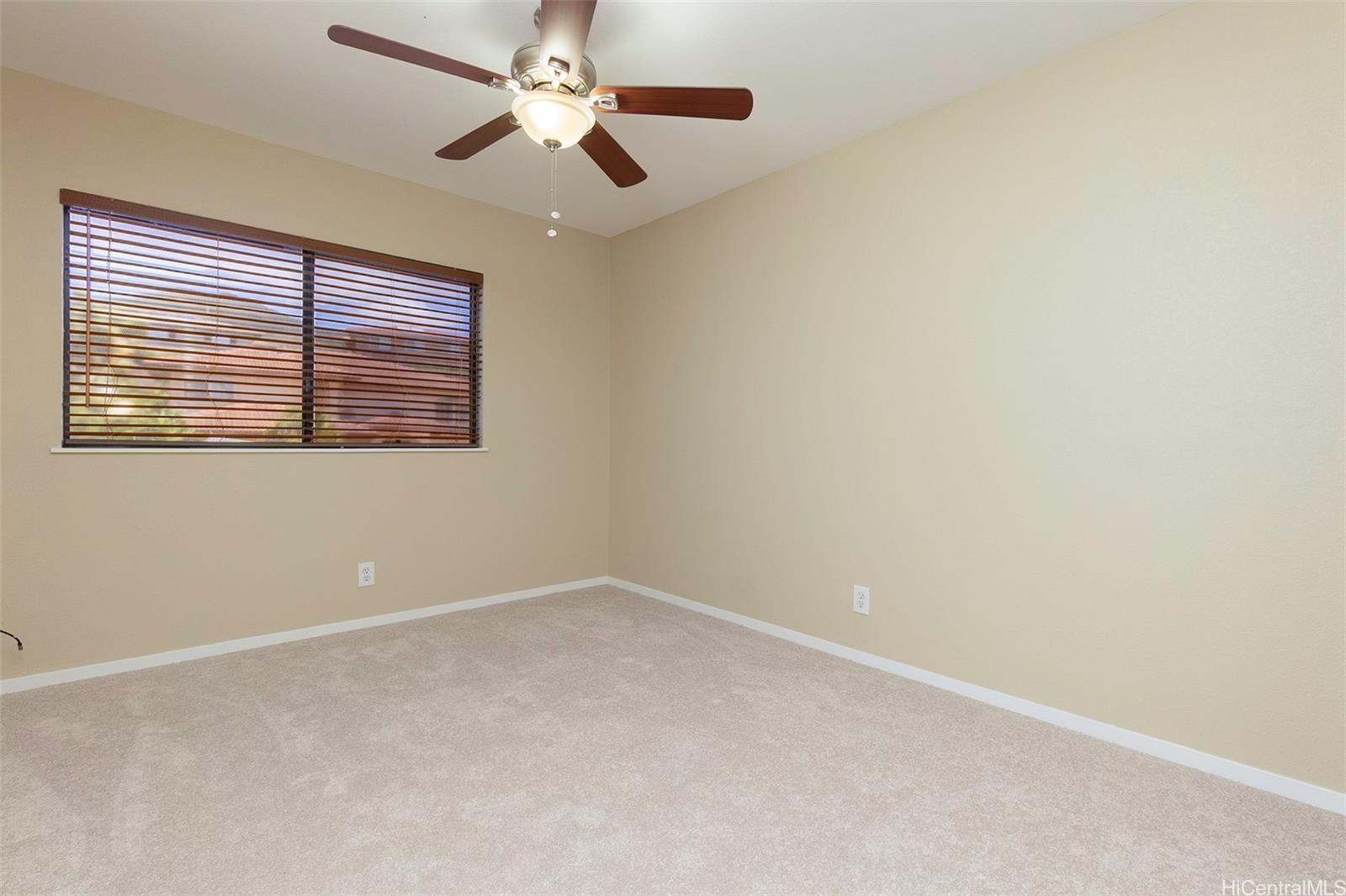 92-247 Opuakii Place Kapolei, HI 96707 - Photo 22 of 25 an empty room with a window and a fan