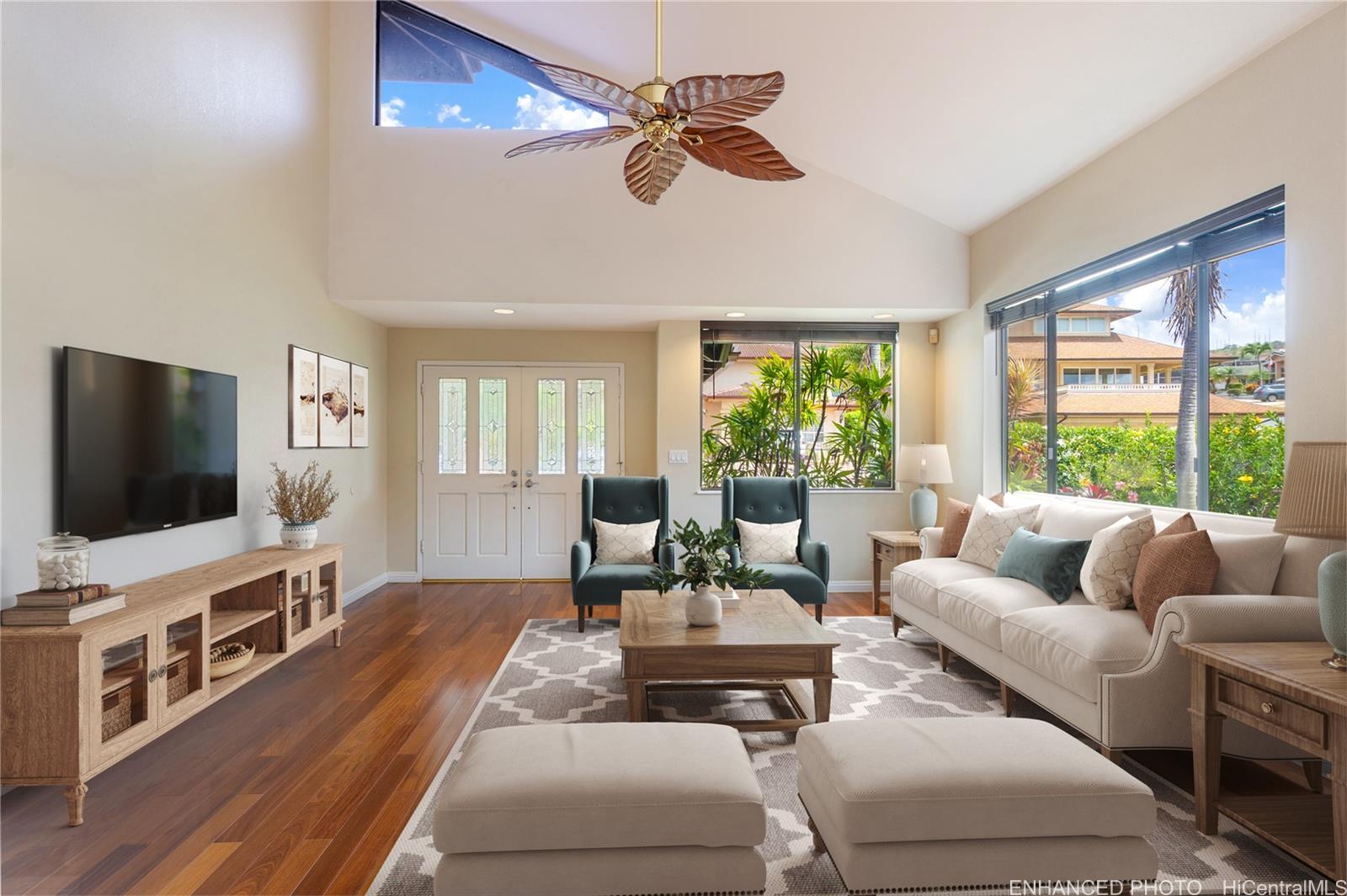 92-247 Opuakii Place Kapolei, HI 96707 - Photo 4 of 25 a living room with furniture and a flat screen tv
