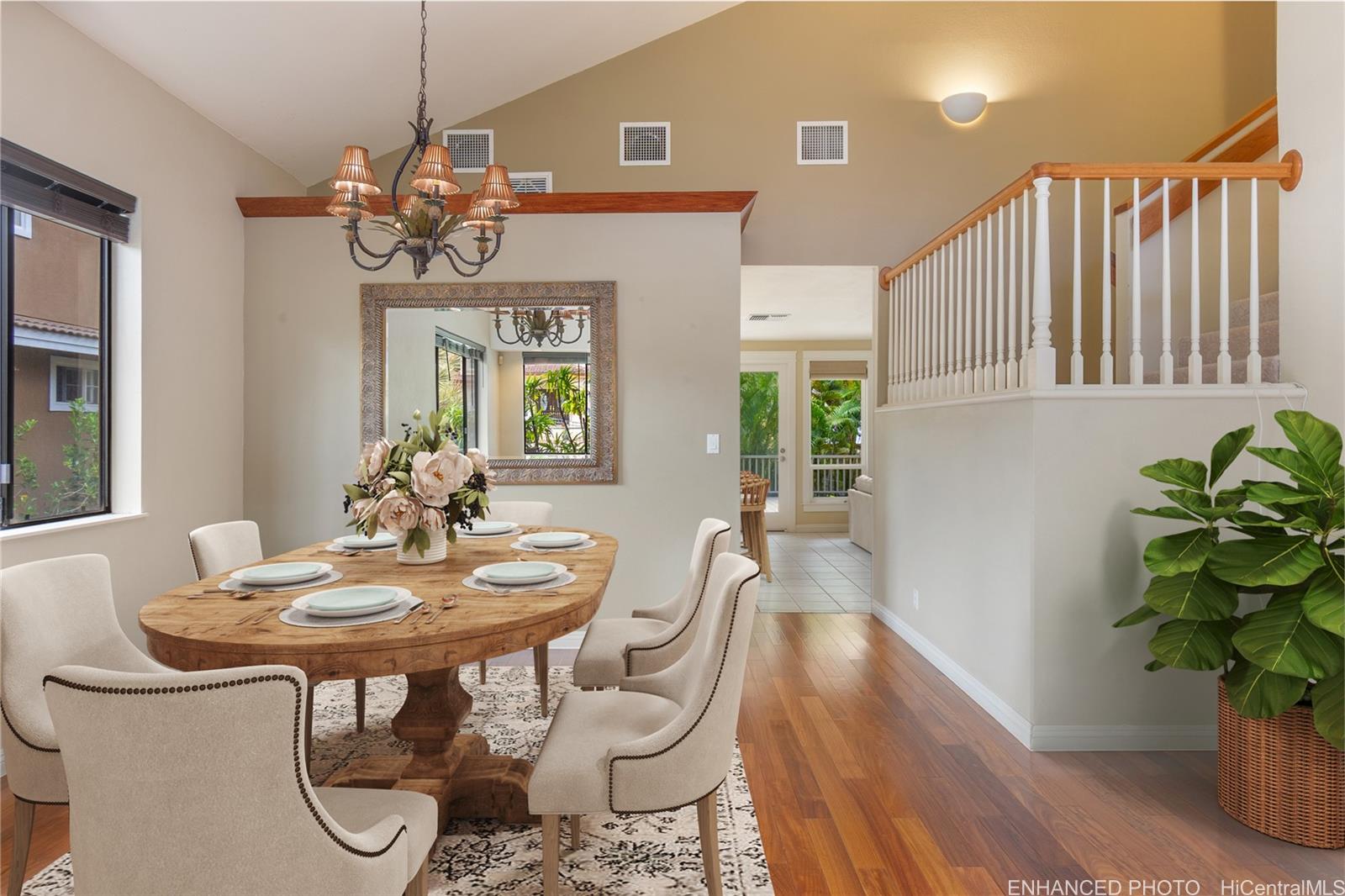 92-247 Opuakii Place Kapolei, HI 96707 - Photo 7 of 25 a view of a dining room with furniture wooden floor and chandelier