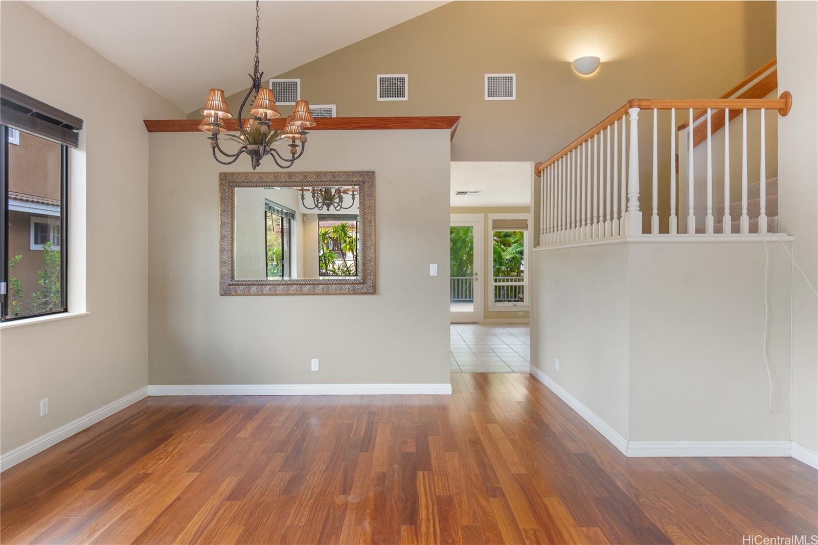 92-247 Opuakii Place Kapolei, HI 96707 - Photo 8 of 25 a view of a livingroom with wooden floor and windows