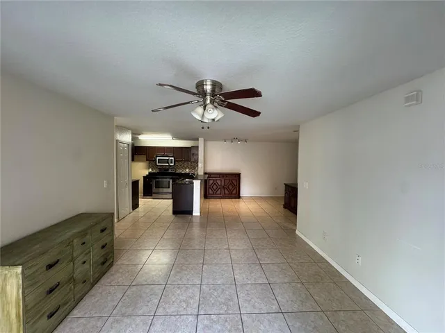 a view of a kitchen with a sink and dishwasher cabinets
