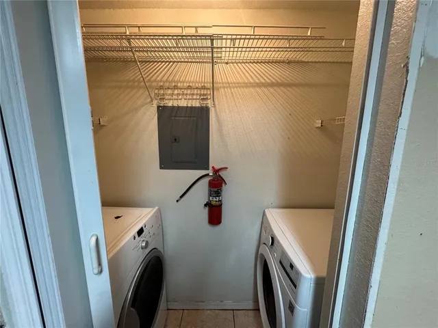a bathroom with a sink and a washer dryer