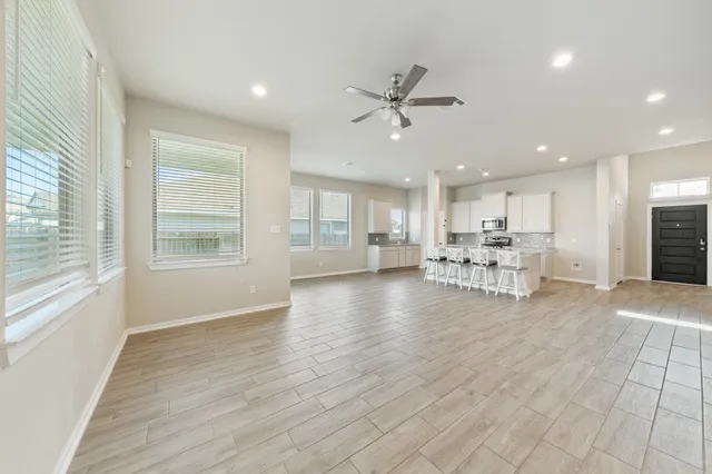 a view of dining room with furniture window and wooden floor