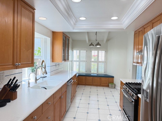 24 Carver Irvine, CA 92620 - Photo 6 of 18 a kitchen with a sink a stove and a refrigerator