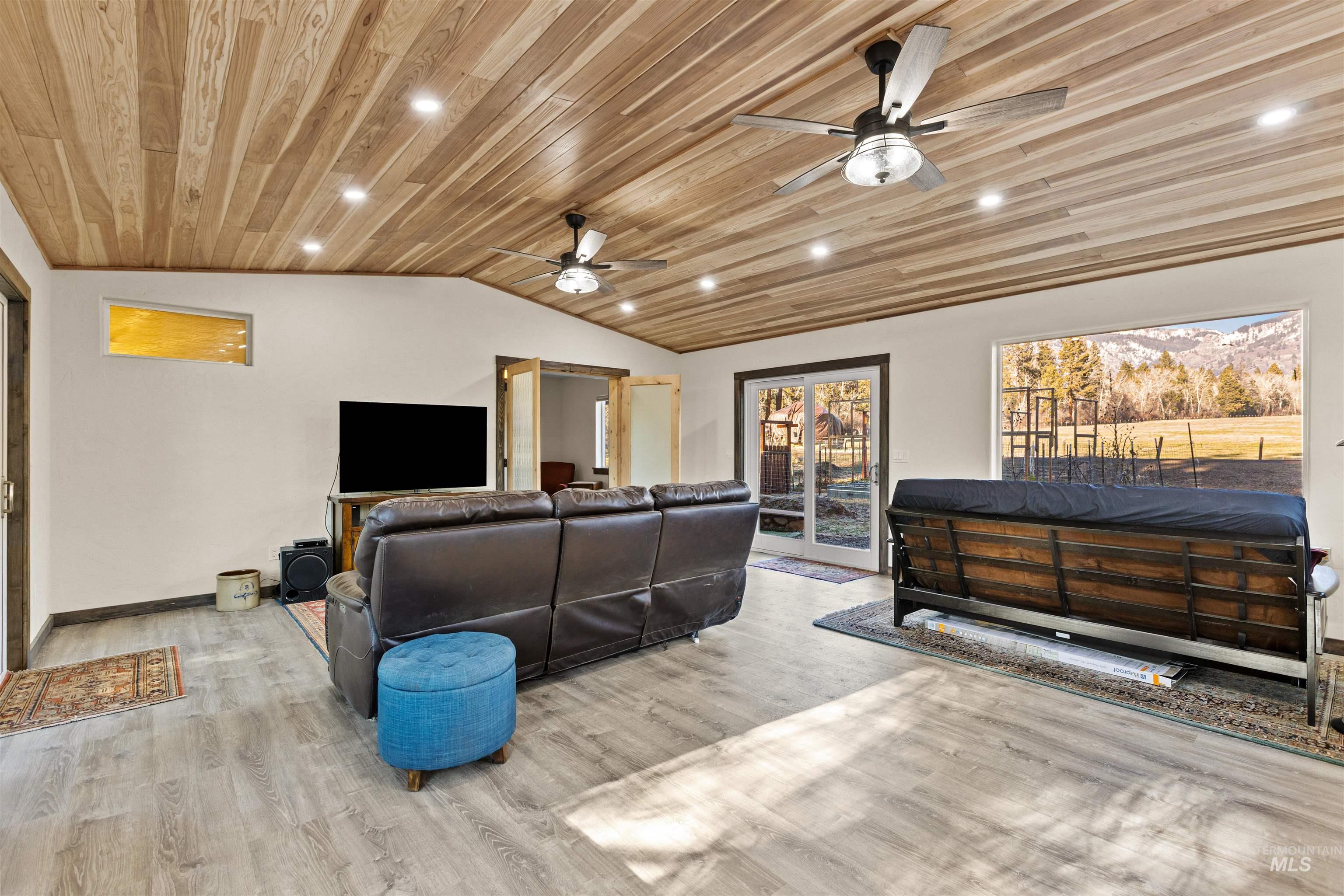 3488 Ward Road Cambridge, ID 83610 - Photo 13 of 49 Sunroom with recessed lighting, lofted ceiling, wooden ceiling, wood finished floors, and ceiling fan