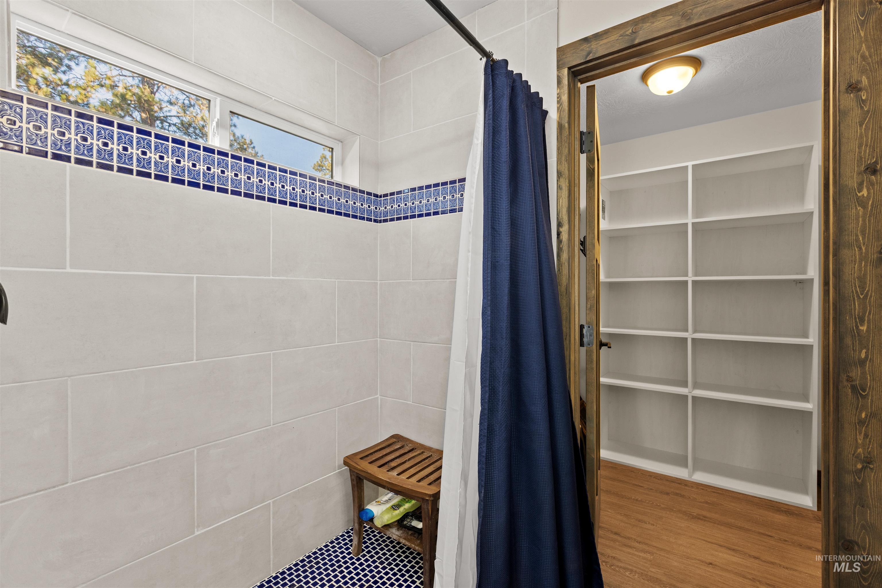 3488 Ward Road Cambridge, ID 83610 - Photo 27 of 49 Bathroom featuring a shower stall and wood finished floors