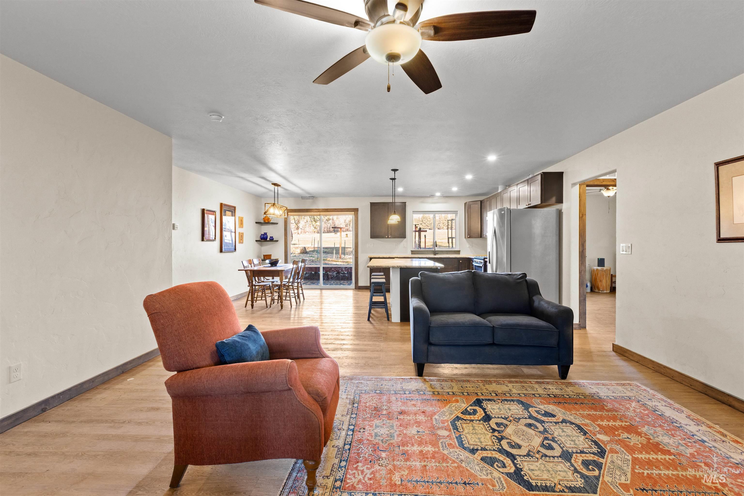 3488 Ward Road Cambridge, ID 83610 - Photo 4 of 49 Living area with ceiling fan, light wood-type flooring, and recessed lighting