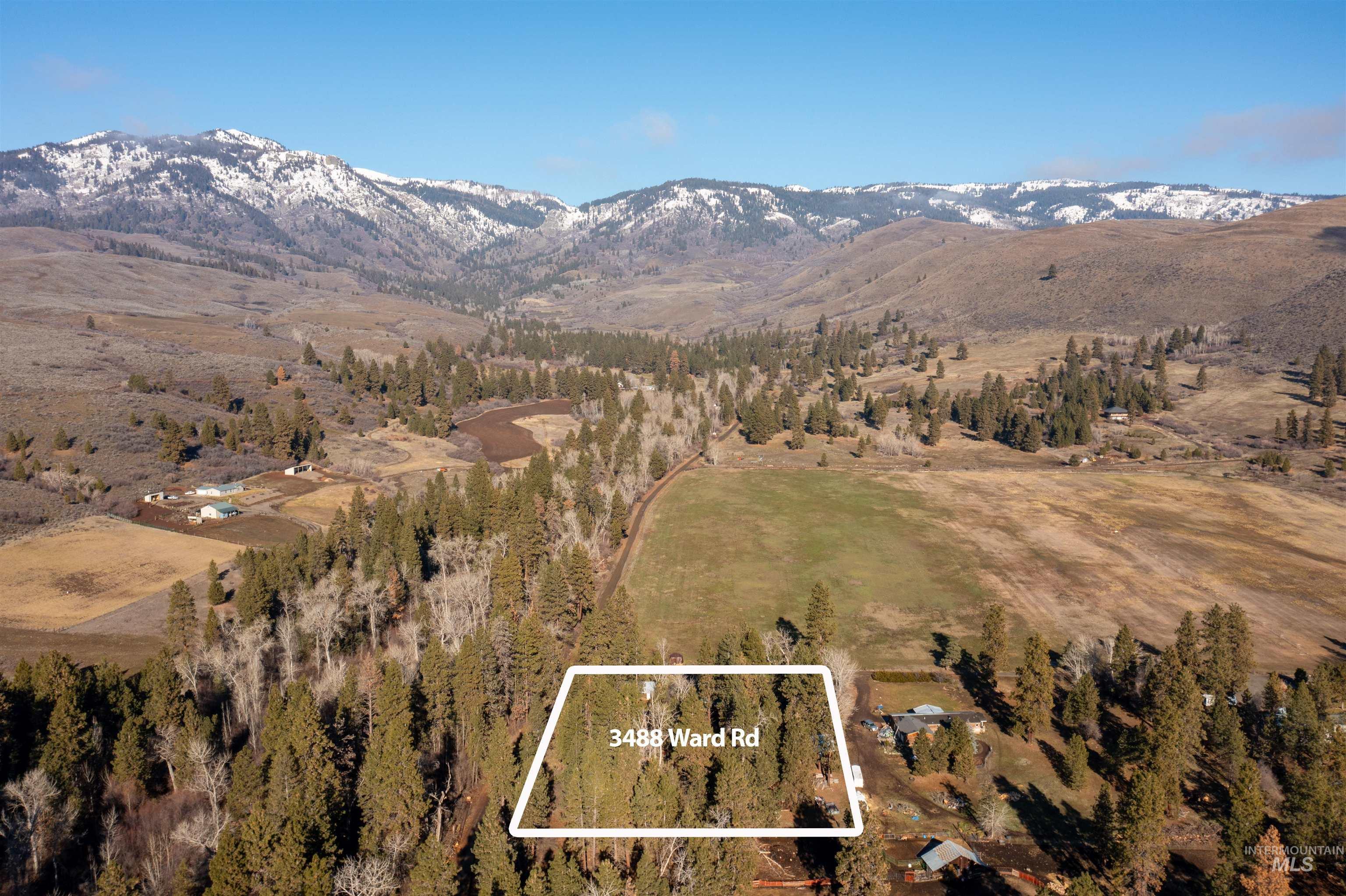 3488 Ward Road Cambridge, ID 83610 - Photo 43 of 49 Aerial view of property and surrounding area featuring property boundaries highlighted and a mountain backdrop