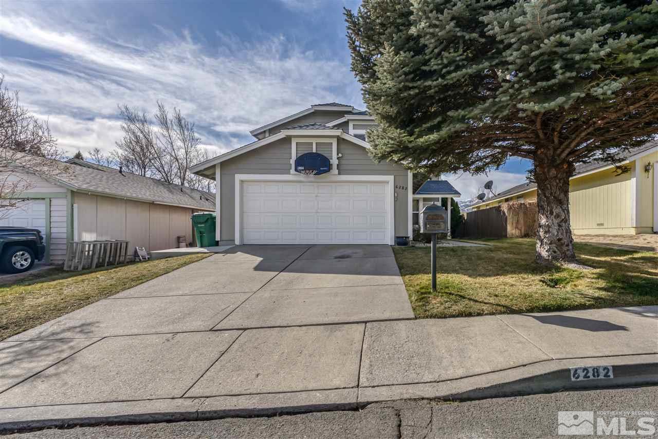 6282 Chesterfield Lane Reno, NV 89523 - Photo 1 of 34 a front view of a house with garage and parking