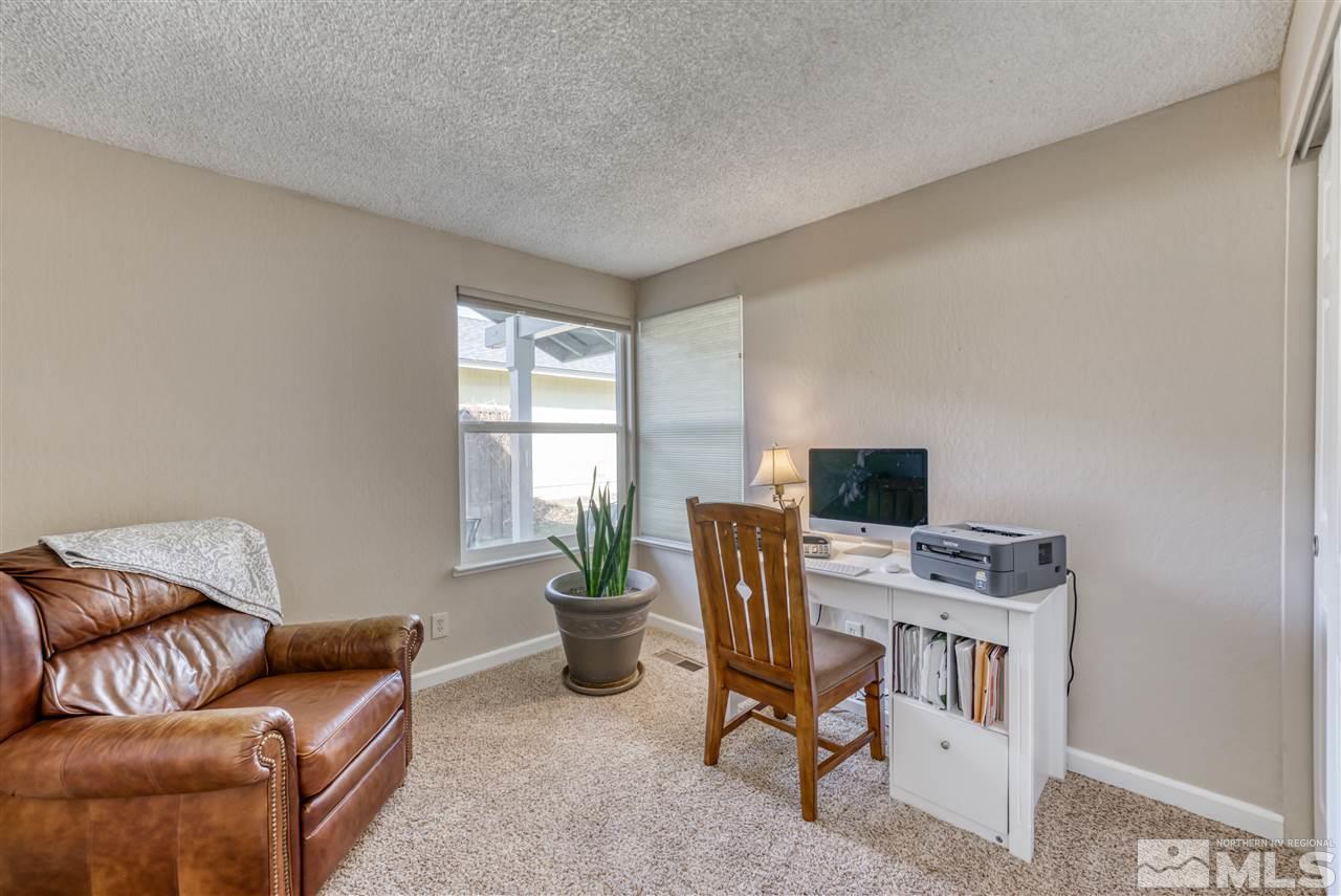 6282 Chesterfield Lane Reno, NV 89523 - Photo 25 of 34 a view of a livingroom with furniture and windows