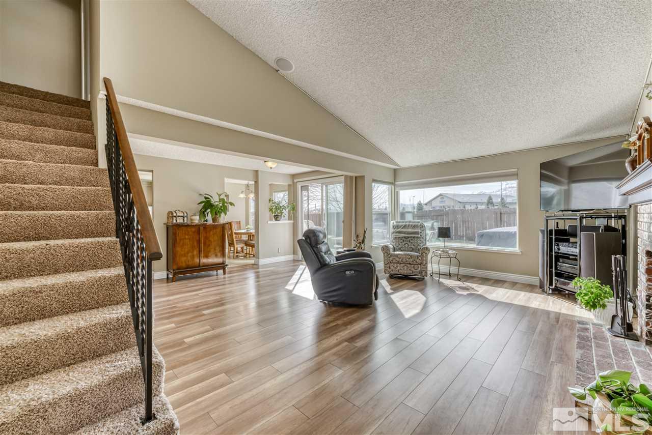 6282 Chesterfield Lane Reno, NV 89523 - Photo 4 of 34 a living room with furniture and a wooden floor