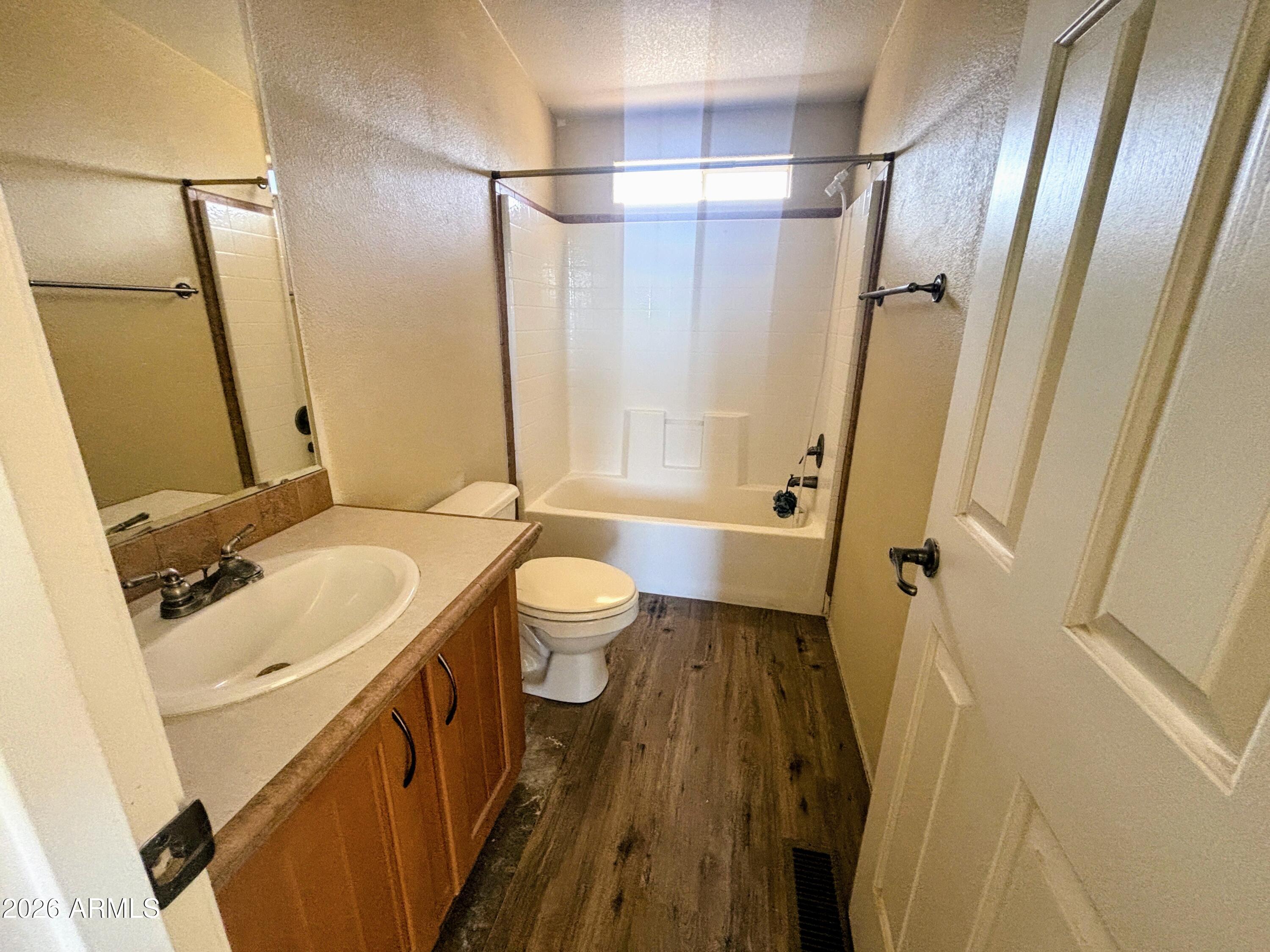 111 County Road, Unit 8015 Show Low, AZ 85901 - Photo 13 of 34 a bathroom with a sink a toilet a mirror and shower