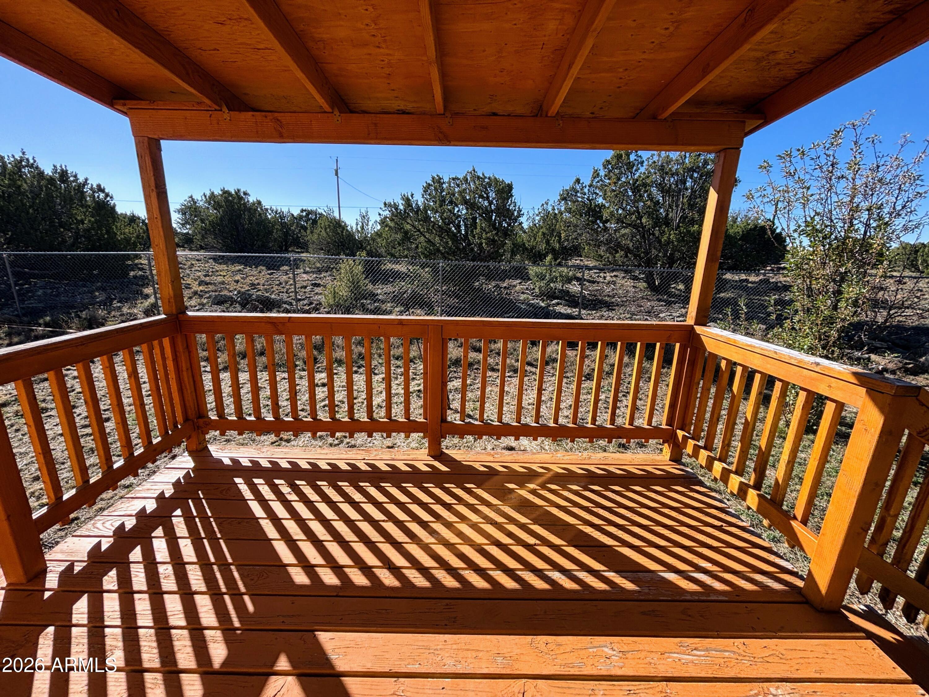 111 County Road, Unit 8015 Show Low, AZ 85901 - Photo 15 of 34 a view of a balcony with wooden floor
