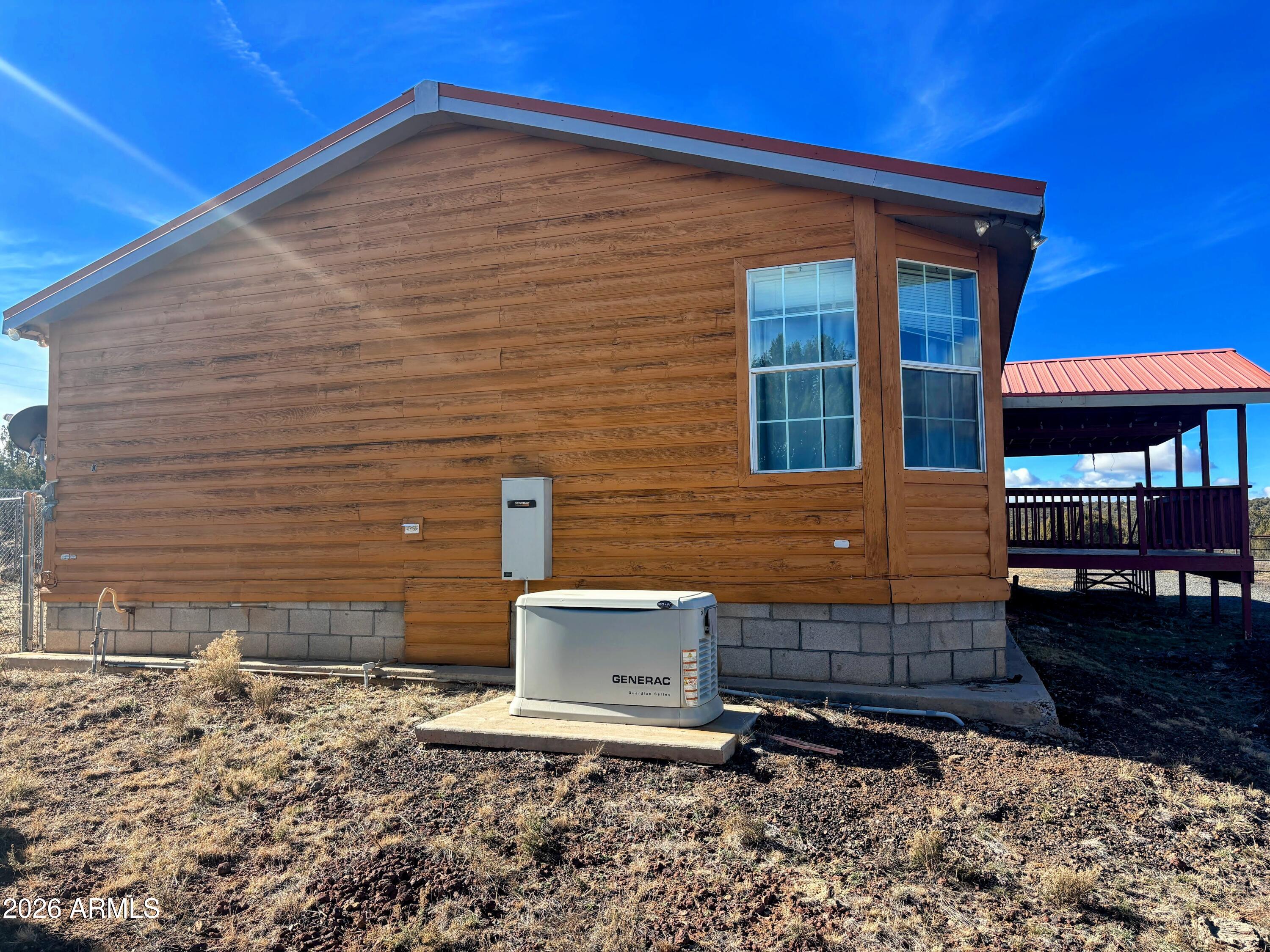 111 County Road, Unit 8015 Show Low, AZ 85901 - Photo 22 of 34 a front view of a house with parking space