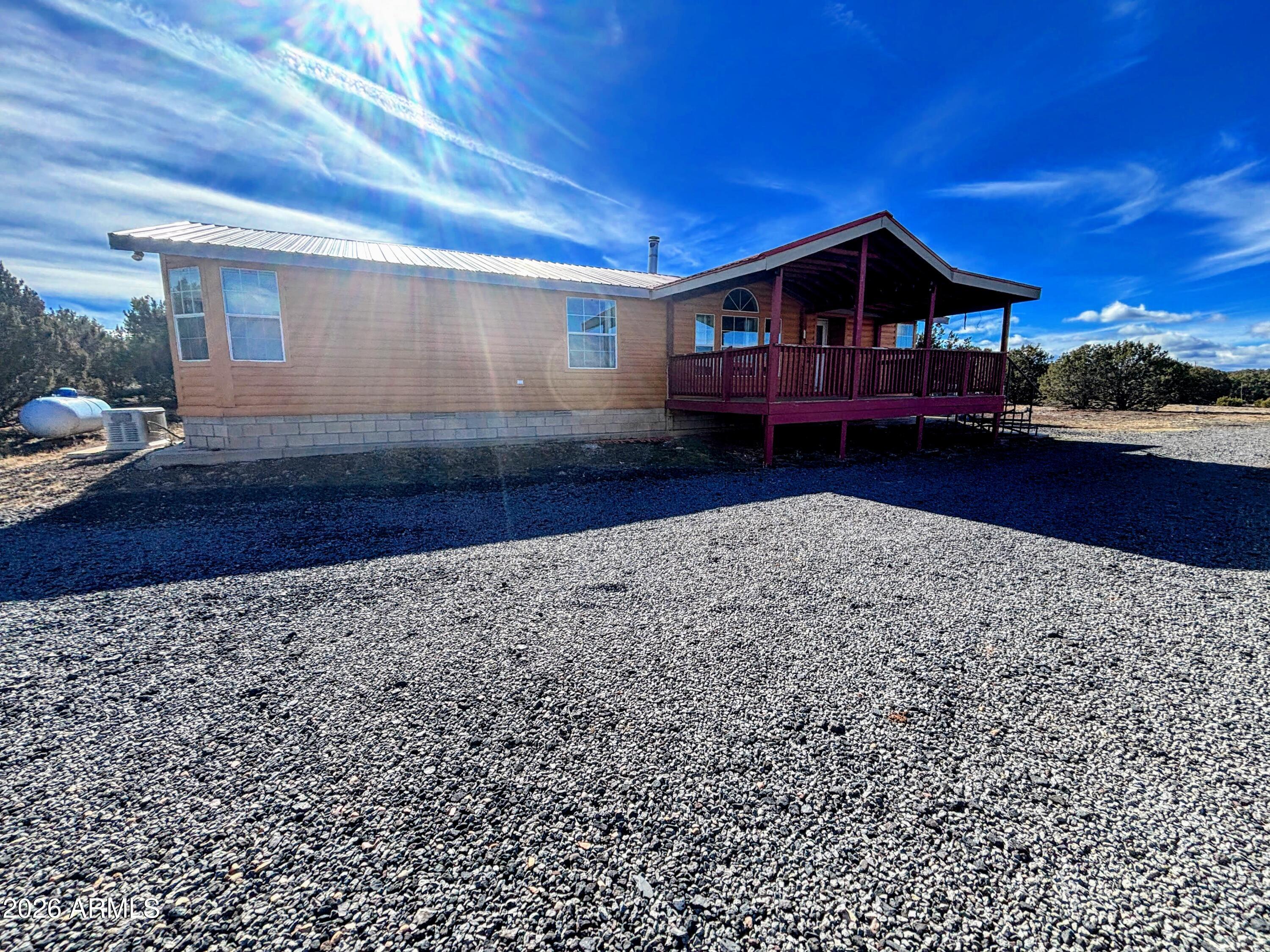111 County Road, Unit 8015 Show Low, AZ 85901 - Photo 25 of 34 a front view of a house with garden