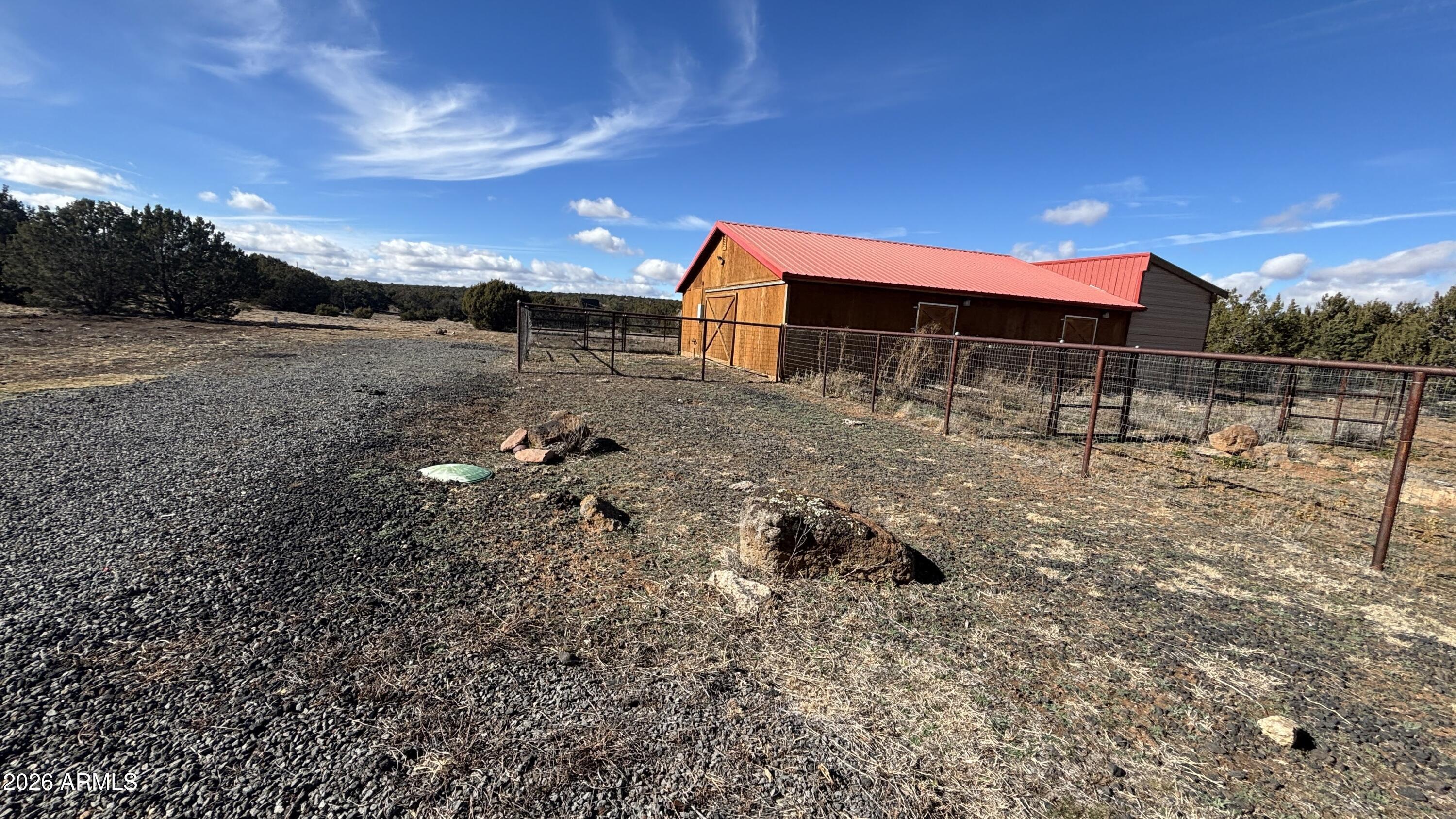 111 County Road, Unit 8015 Show Low, AZ 85901 - Photo 26 of 34 a backyard of a house with table and chairs