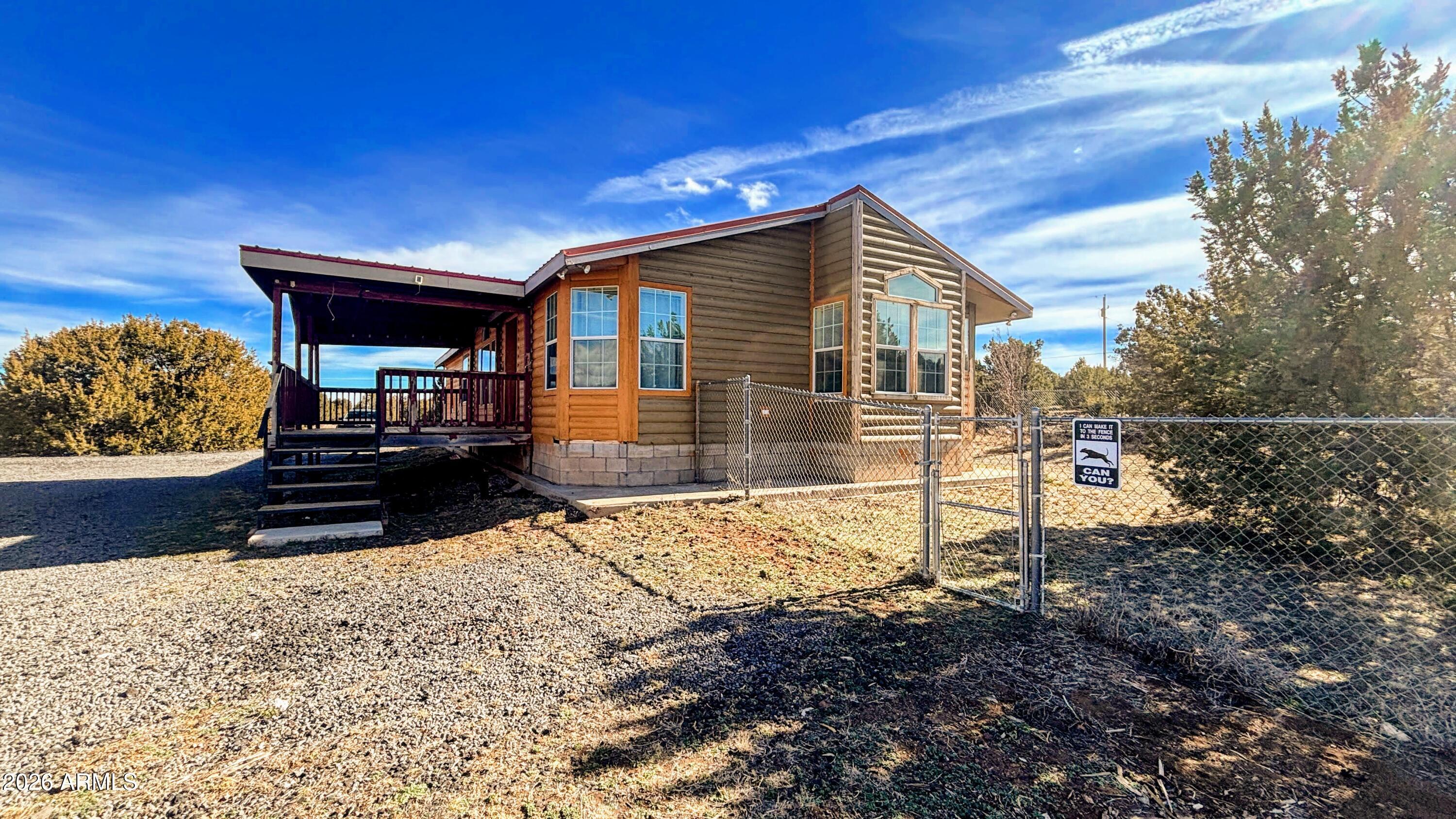 111 County Road, Unit 8015 Show Low, AZ 85901 - Photo 27 of 34 a house view with a backyard space