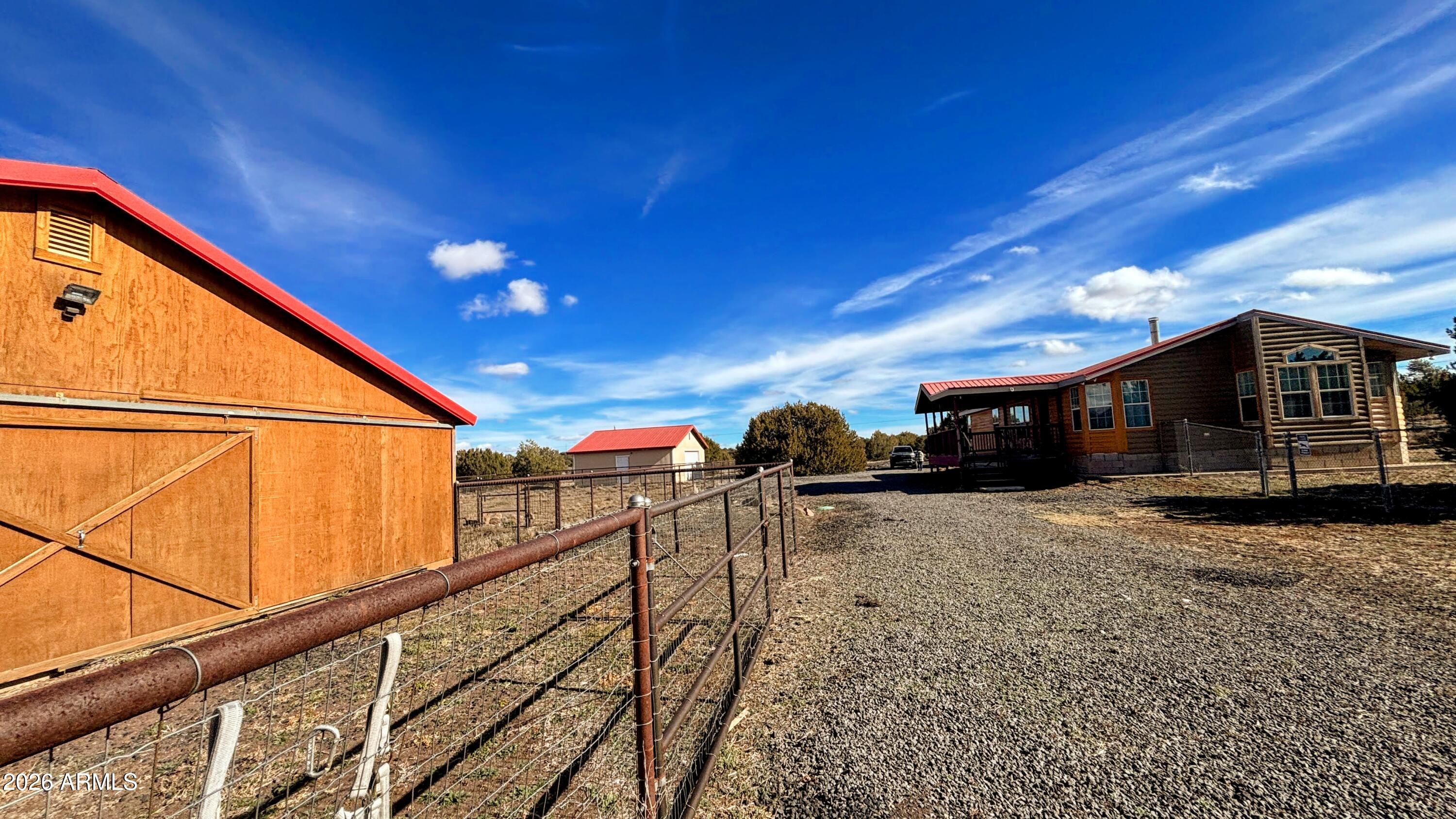 111 County Road, Unit 8015 Show Low, AZ 85901 - Photo 30 of 34 a view of a street with wooden fence